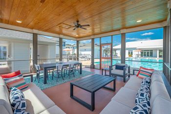 Screened-in patio and social space at Anthem Apartments and Luxury Rentals in Huntsville, AL
